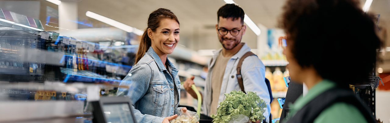 A woman and man grocery shopping