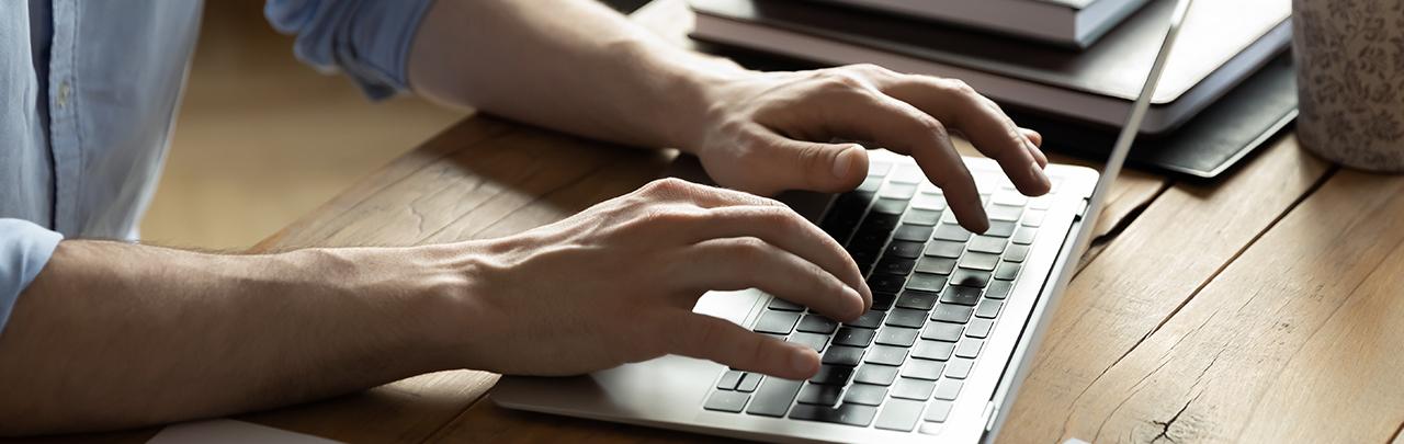 Man typing on a keyboard