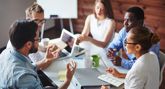 Group of people working around a table