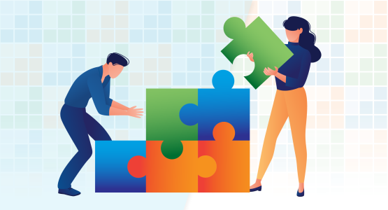 Two people building the Paradigm logo out of building blocks