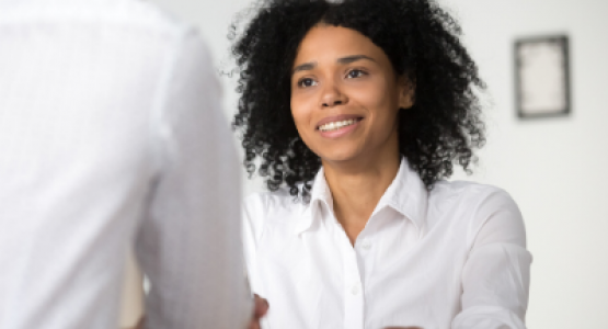 Woman listening in an interview setting